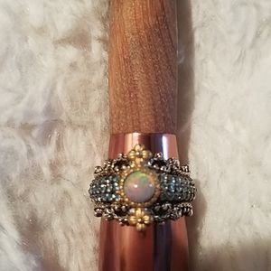 Opal and blue topaz ring